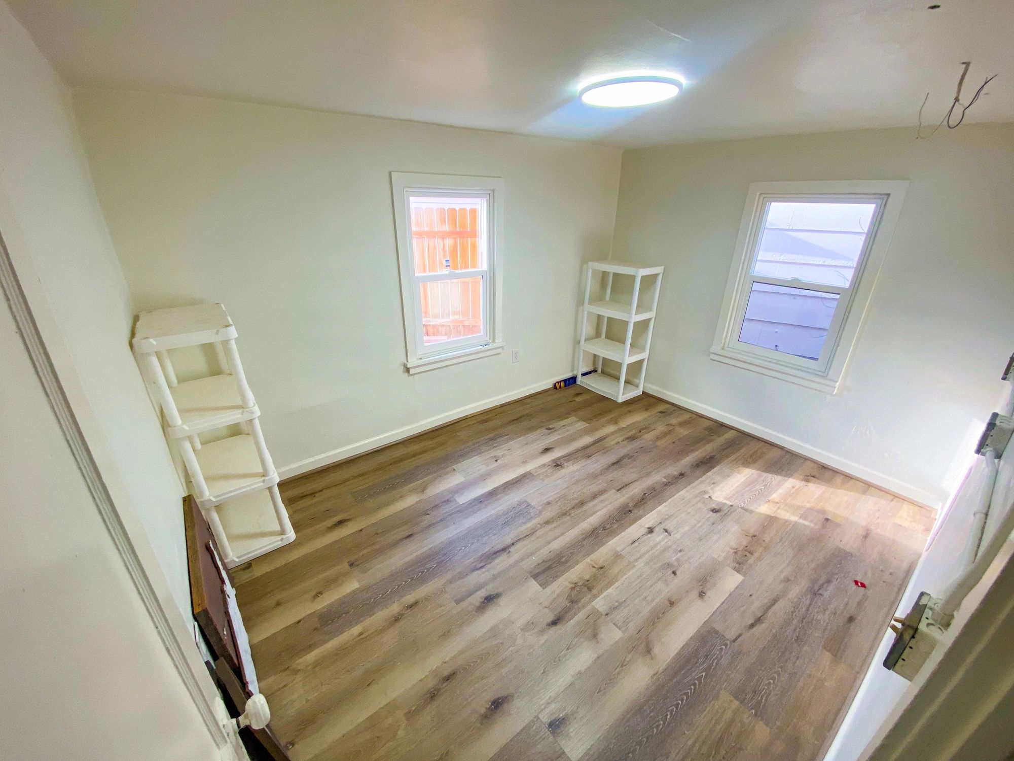 Bedroom with newly installed vinyl plank flooring