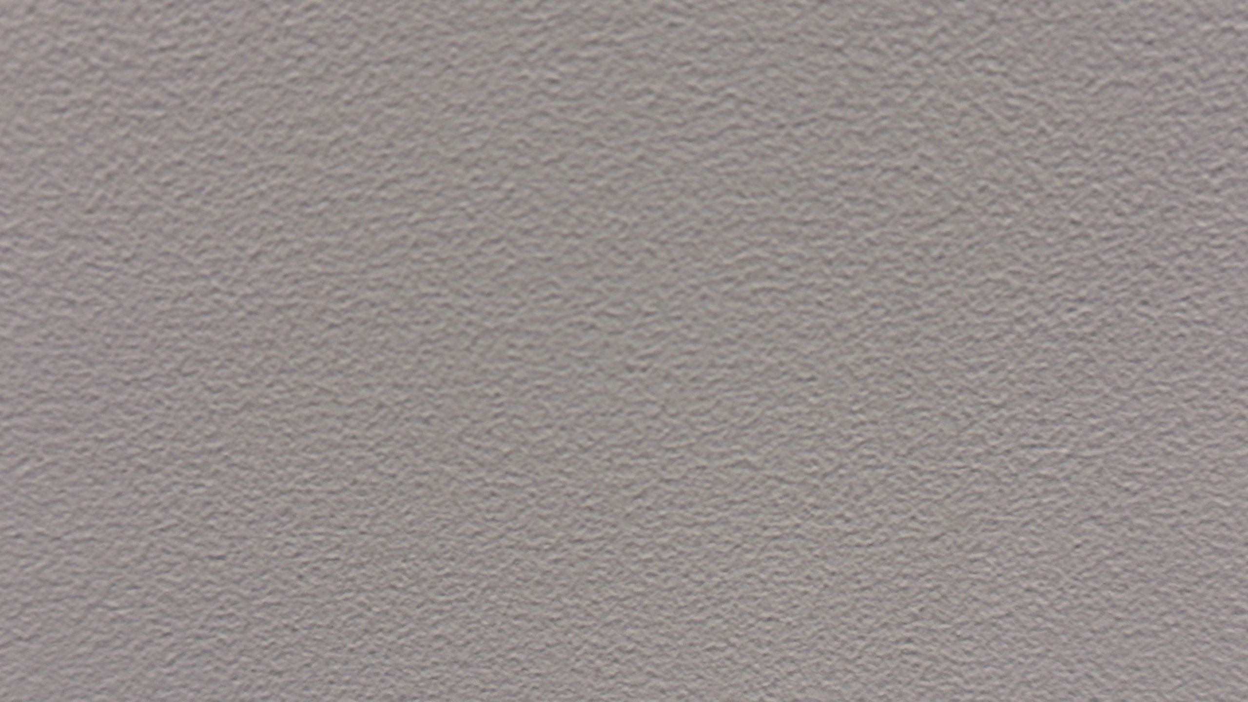 Smooth textured wall surface representing drywall finishing